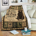 Labrador Retriever blanket displayed on a sofa with rustic dog-themed artwork