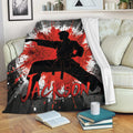 Karate blanket displayed on a sofa with dramatic martial arts silhouette and red graphic design
