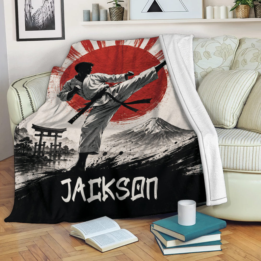 Karate blanket draped over a sofa with martial artist, mountain, torii gate and red sun design