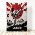 Karate throw blanket with martial artist performing a high kick against Japanese-inspired red sun artwork