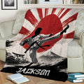 Japanese-inspired karate throw blanket displayed on a couch with martial arts and mountain artwork