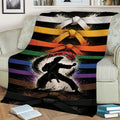 Karate throw blanket draped over a couch with martial arts silhouette and belt artwork