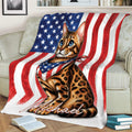 Spotted Bengal cat blanket displayed across a sofa with patriotic flag artwork