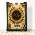 Sign language throw blanket with a hand gesture framed by sunflowers and ornate botanical artwork