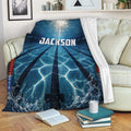 Swimming throw blanket displayed on a sofa with blue pool lane artwork and splashing water details