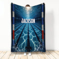 Custom swimming blanket with blue underwater pool lanes, splashing water, and colorful racing lane lines