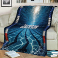 Blue swimming pool lane blanket styled across a sofa with underwater reflections and racing lane lines