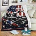 Swimming throw blanket displayed on a sofa with dramatic swimmer artwork and patriotic red, white and blue colors