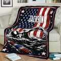 Swimming blanket draped over a couch with illustrated swimmer, water splashes and bold patriotic design