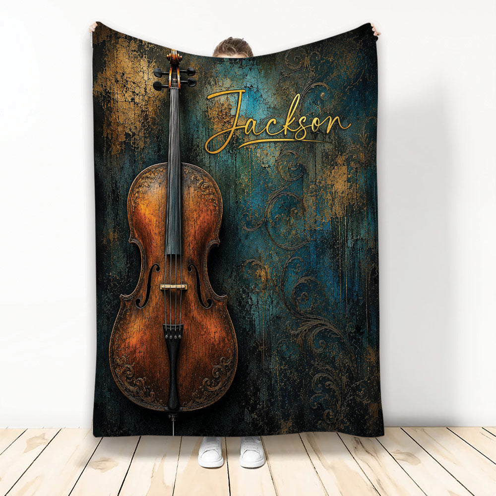 Ornate cello throw blanket displayed upright with distressed teal and bronze artwork