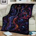 Decorative cello blanket displayed across a sofa with vibrant floral and cosmic artwork
