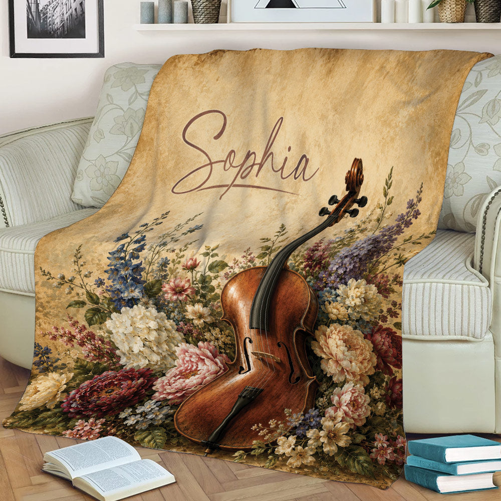 Cello throw blanket with detailed floral artwork draped across a living room chair