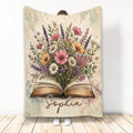 Open book blanket with a colorful floral bouquet and soft watercolor-style botanical artwork