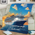 Cruise ship throw blanket displayed on a sofa with ocean waves, blue skies, and warm sunset colors