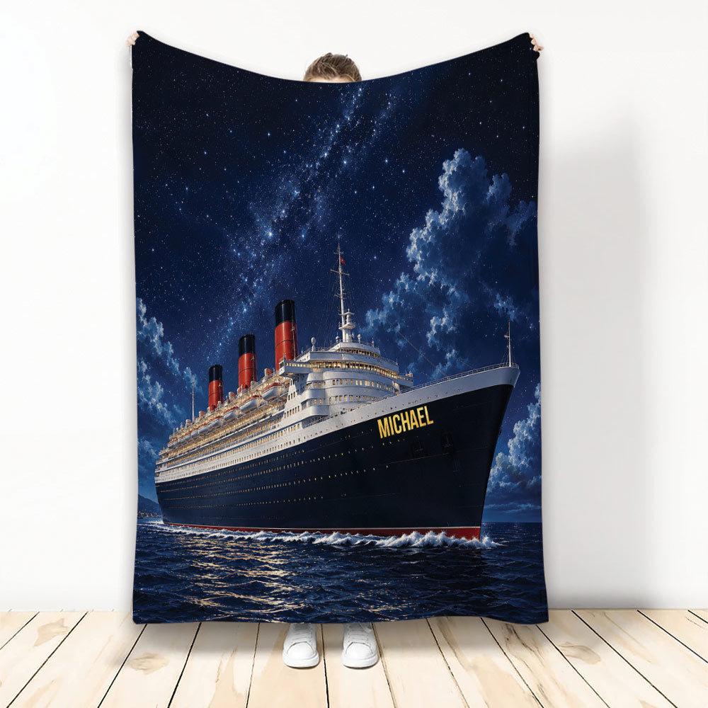 Cruise ship throw blanket displayed against a wall with a starry night sky and ocean artwork