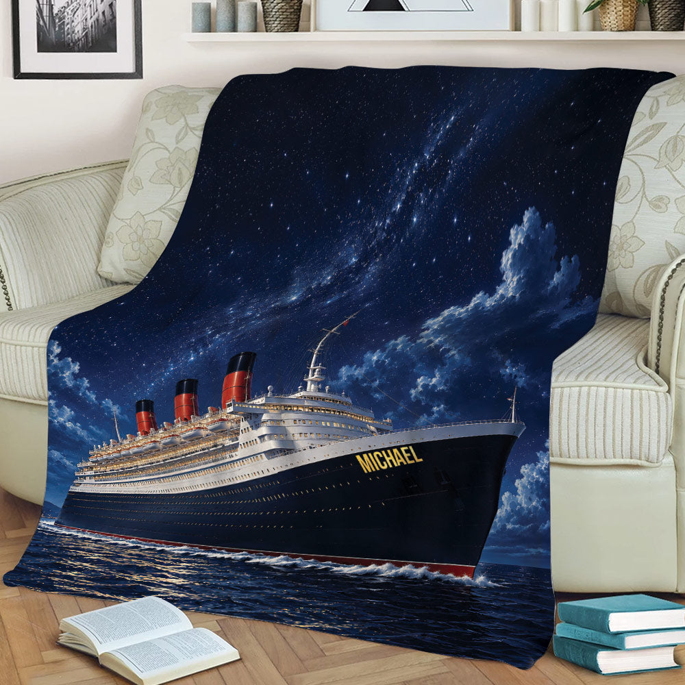 Cruise ship throw blanket draped over a sofa, featuring waves, clouds, and a deep blue starry sky