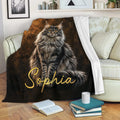 Maine Coon throw blanket draped over a sofa, featuring a detailed long-haired cat design in warm brown tones