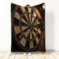 Dart board throw blanket displayed with darts in a bold black, red, green, and tan game room design