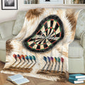 Close view of a dart board blanket draped over a sofa with dartboard and colorful dart artwork