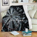 Dart Board Throw Blanket draped over a sofa with shattered target and dart artwork