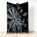 Dart Board Throw Blanket with three darts striking a shattered target in dramatic black and silver artwork