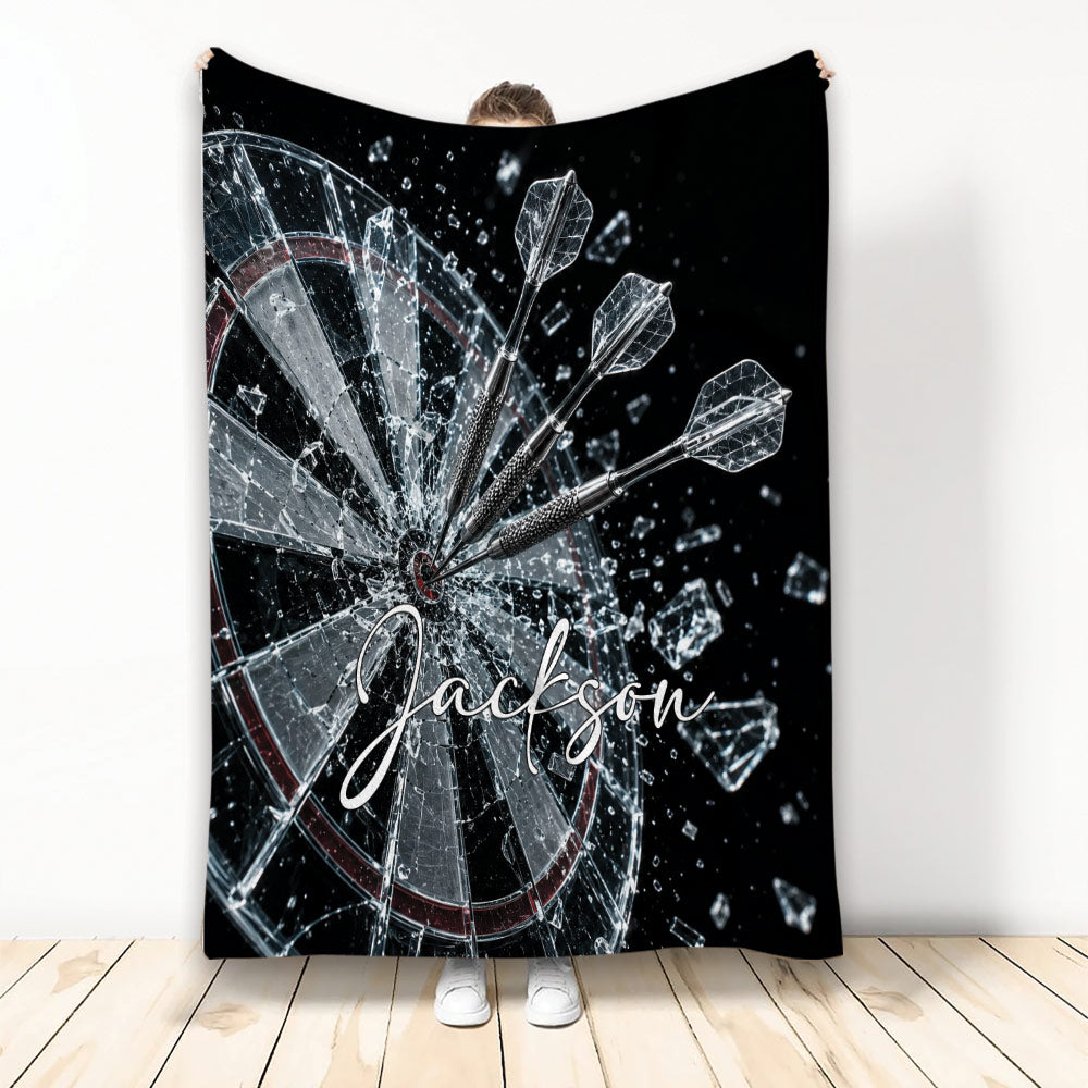 Dart Board Throw Blanket with three darts striking a shattered target in dramatic black and silver artwork