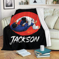 Jiu Jitsu blanket displayed on a sofa with bold red and black grappling artwork