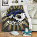 Jiu Jitsu blanket displayed on a sofa with grappling artwork and dramatic black and gold rays