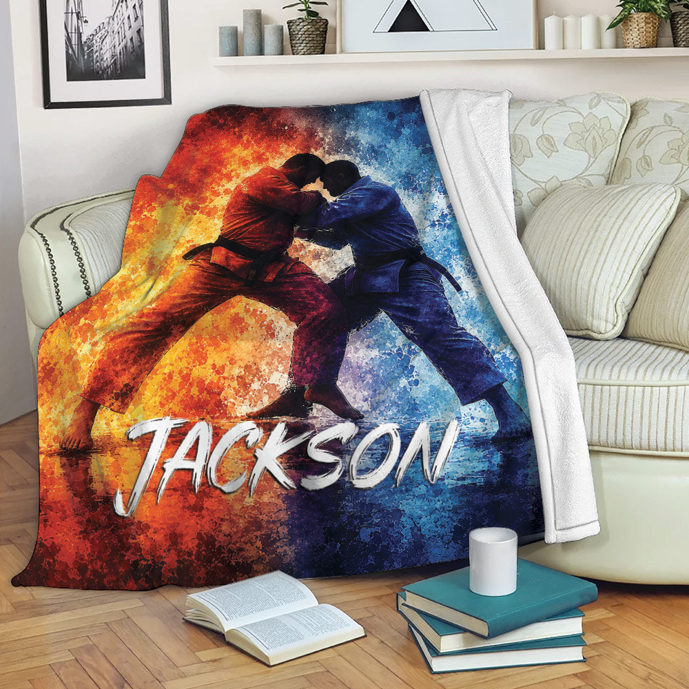 Jiu Jitsu blanket displayed on a sofa with dramatic red and blue grappling artwork