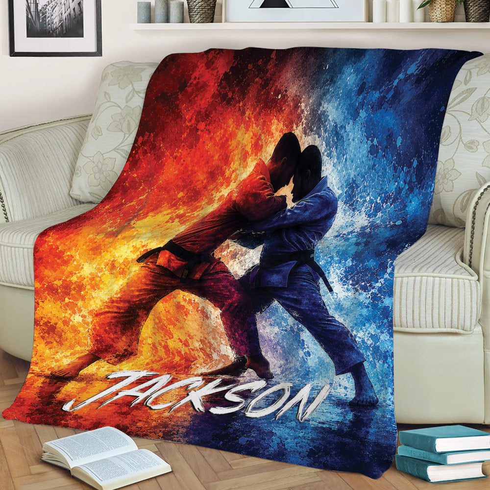 Jiu Jitsu throw blanket draped over a couch featuring two grapplers and bold fiery colors