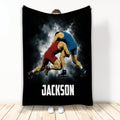 Wrestling throw blanket featuring two wrestlers in red and blue singlets on a dramatic black design