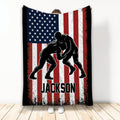 Custom wrestling blanket with two grapplers silhouetted against a distressed American flag design