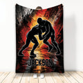 Wrestling throw blanket with two grapplers in a bold black, red, orange and white action design