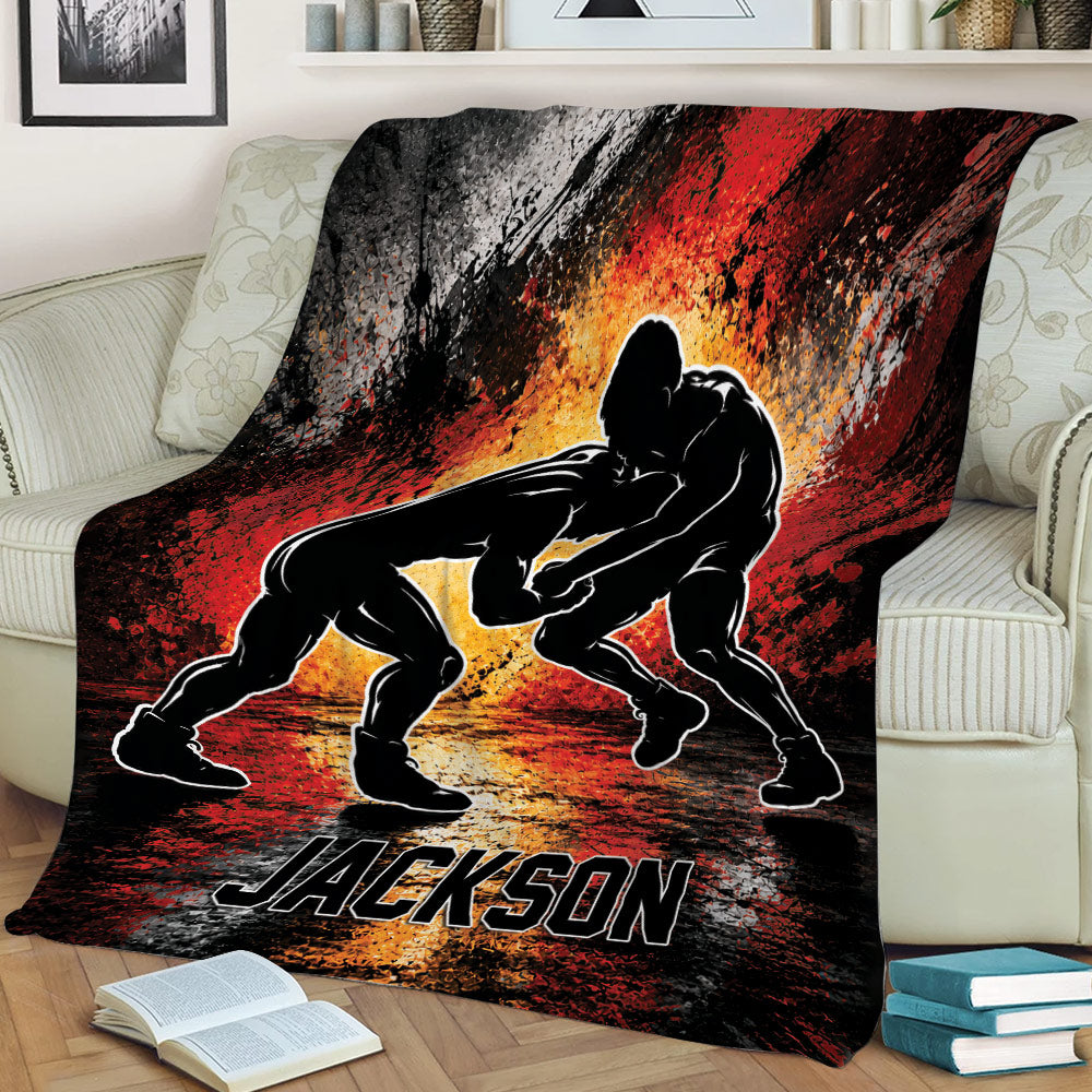 Wrestling throw blanket draped over a couch with two grapplers and intense abstract sports artwork