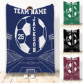 Custom soccer throw blanket displayed in navy with a large soccer ball, stadium lights and field artwork