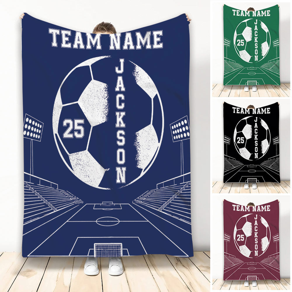Custom soccer throw blanket displayed in navy with a large soccer ball, stadium lights and field artwork