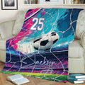 Colorful soccer throw blanket displayed on a couch with ball, goal net, stadium, and vibrant abstract sports artwork