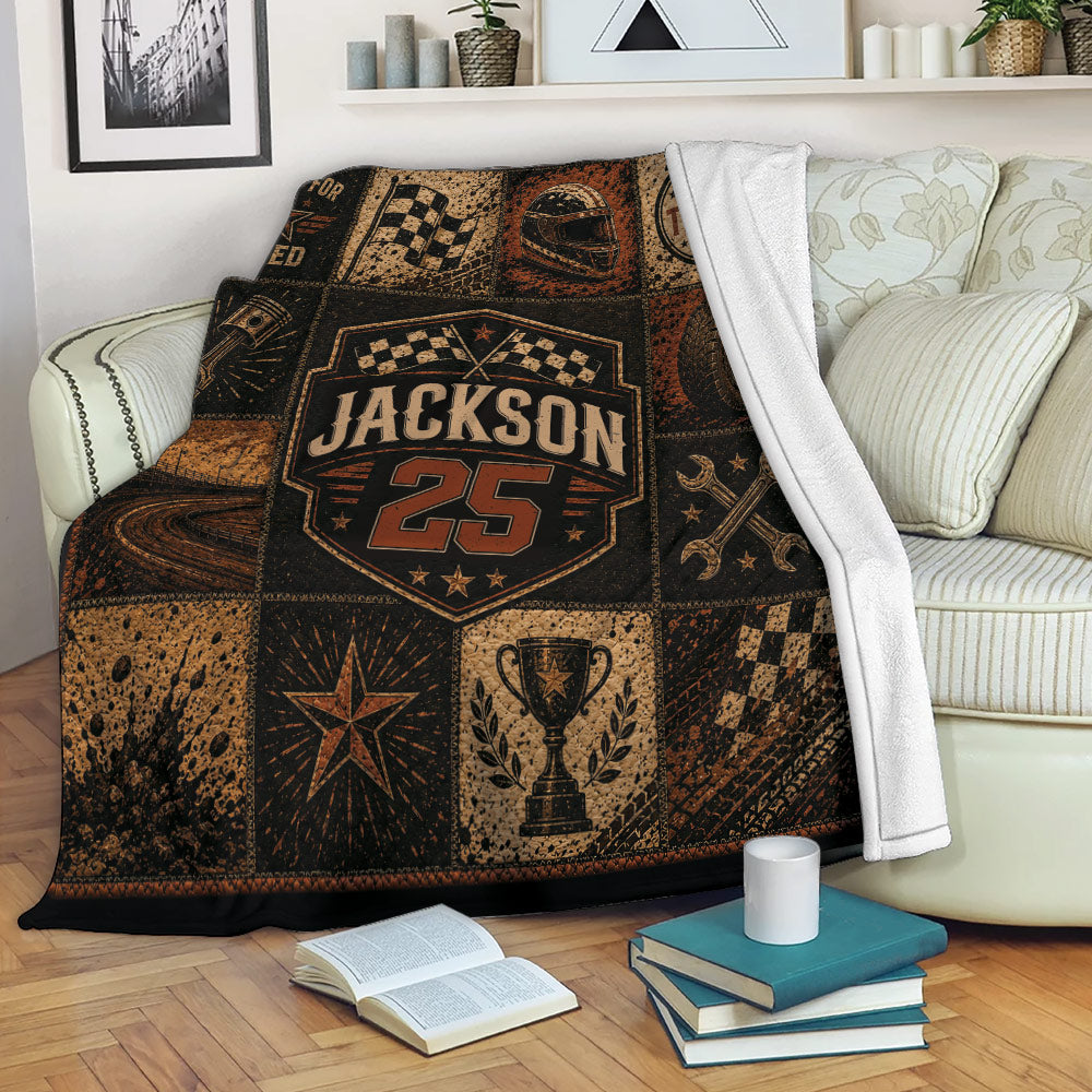 Dirt track racing throw blanket draped over a sofa with checkered flag and motorsport collage design