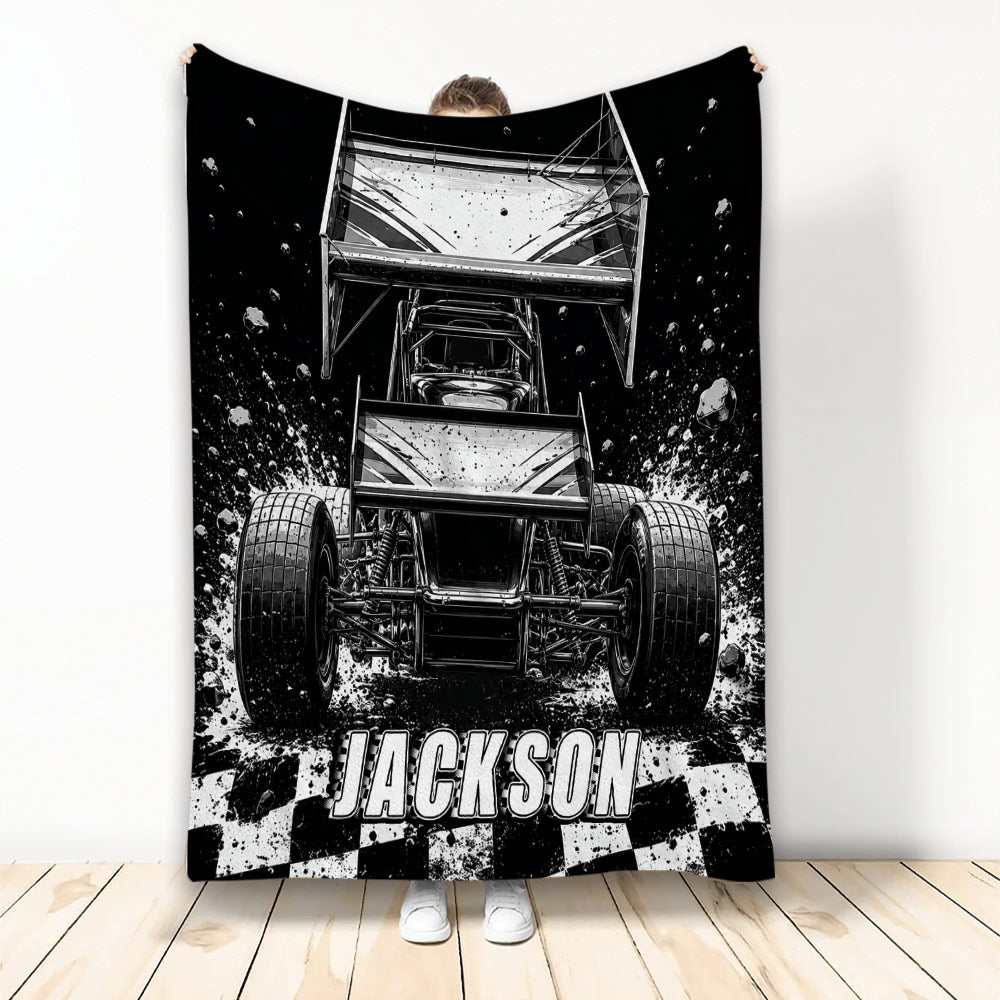 Dirt track racing throw blanket displayed with a black and white sprint car design and checkered flag accents
