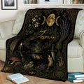 Mystical Wicca throw blanket displayed on a sofa with moon, herb, crystal and cauldron design