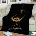 Celestial Wicca throw blanket displayed on a sofa with a golden crescent moon and star design