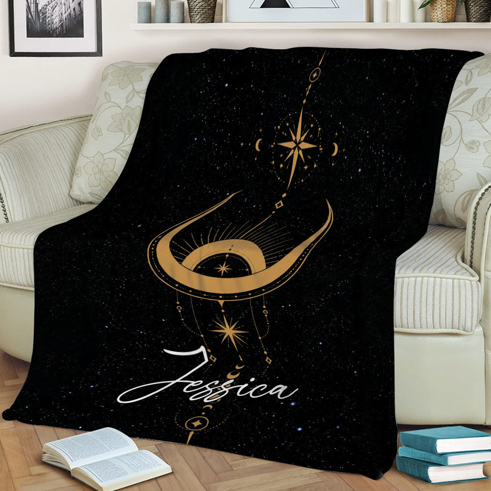 Celestial Wicca throw blanket displayed on a sofa with a golden crescent moon and star design