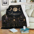 Custom Wicca throw blanket displayed on a sofa with moon phase and ritual-inspired artwork