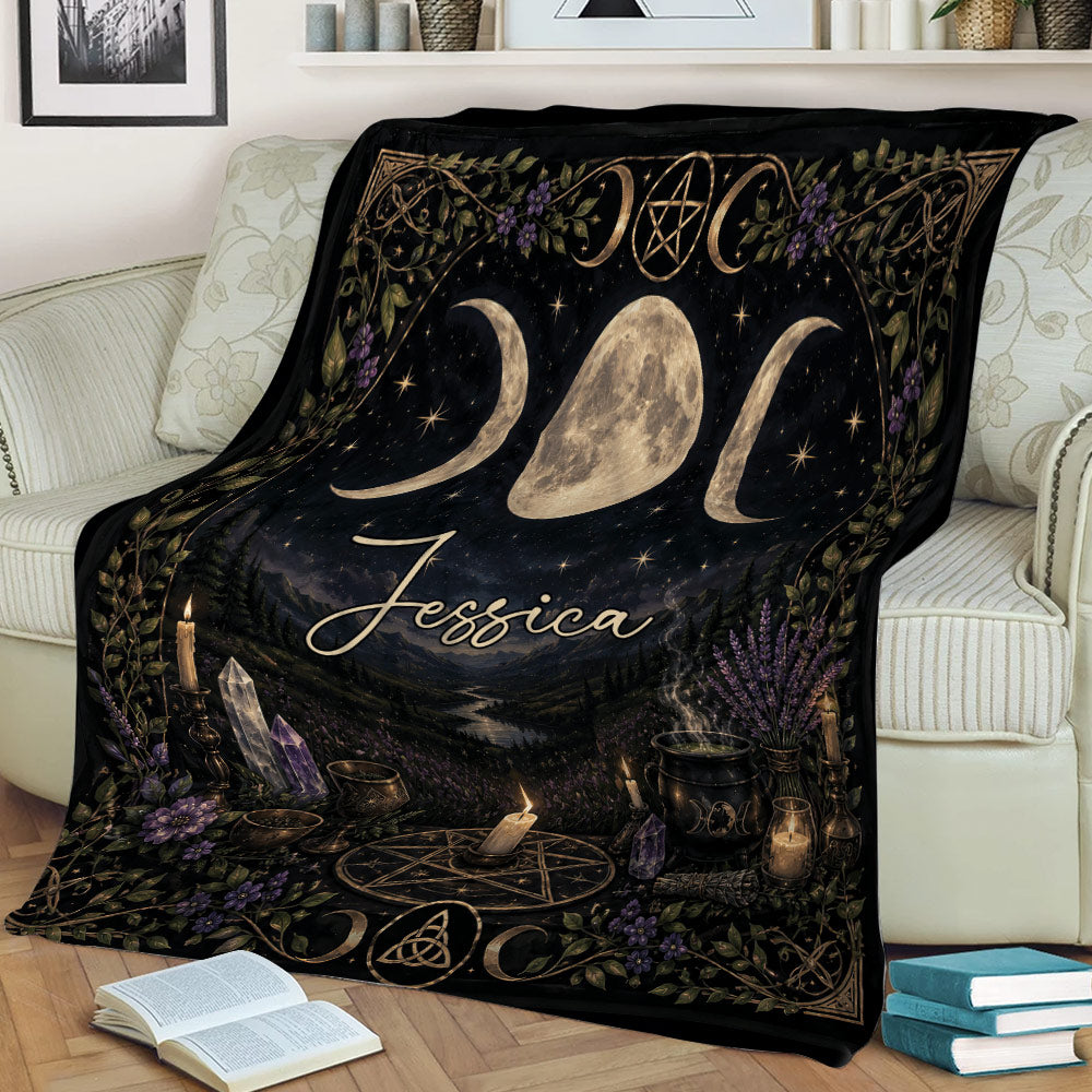 Wicca throw blanket draped over a sofa with lunar symbols, crystals, candles, and cauldron artwork