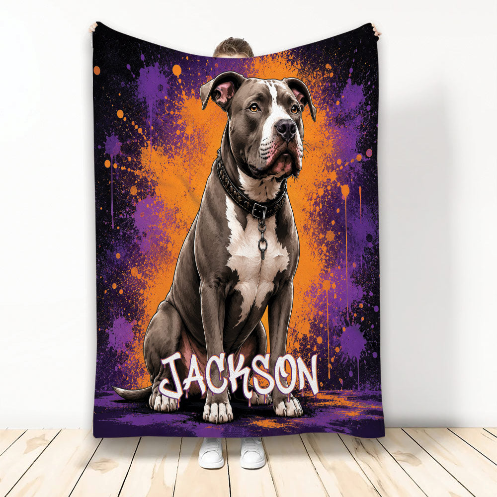 Pitbull throw blanket with bold purple and orange splatter artwork displayed as home decor