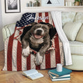 Patriotic pitbull throw blanket draped over a sofa with American flag artwork and cozy reading scene