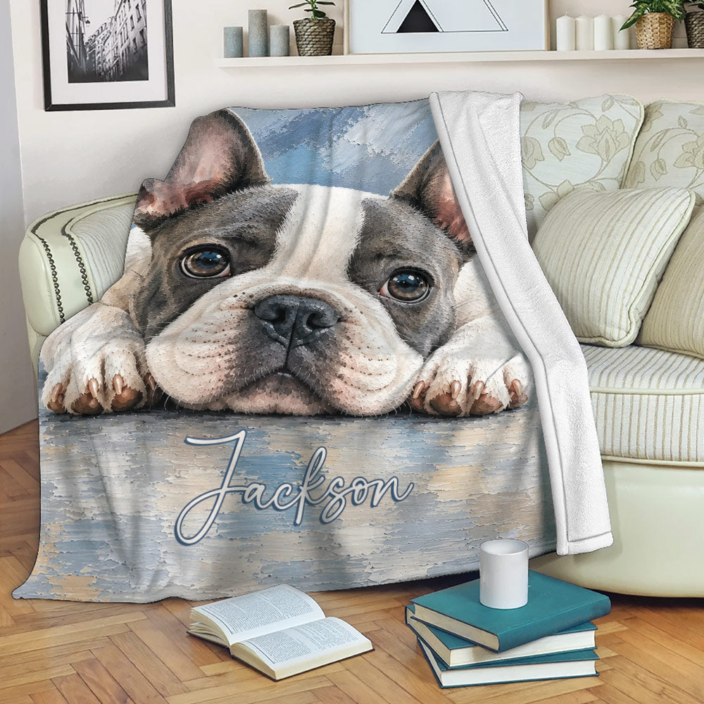 French Bulldog throw blanket draped across a sofa in a cozy living room