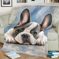 Close view of French Bulldog artwork on a throw blanket styled over a couch