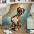 Boxer dog blanket styled across a couch with painterly blue and brown artwork