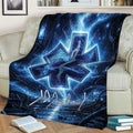 Paramedic throw blanket styled on a couch with blue lightning, caduceus, and Star of Life design